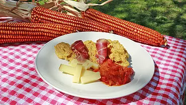 Polenta with cheese and speck
