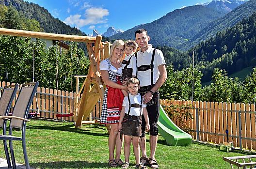 Young farmer Andreas with his wife Siglinde and their sons Michael and Simon