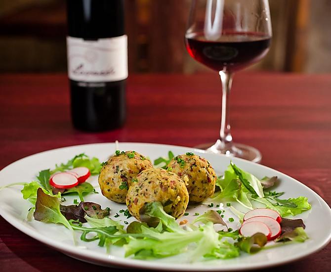 Speck dumpling with salad