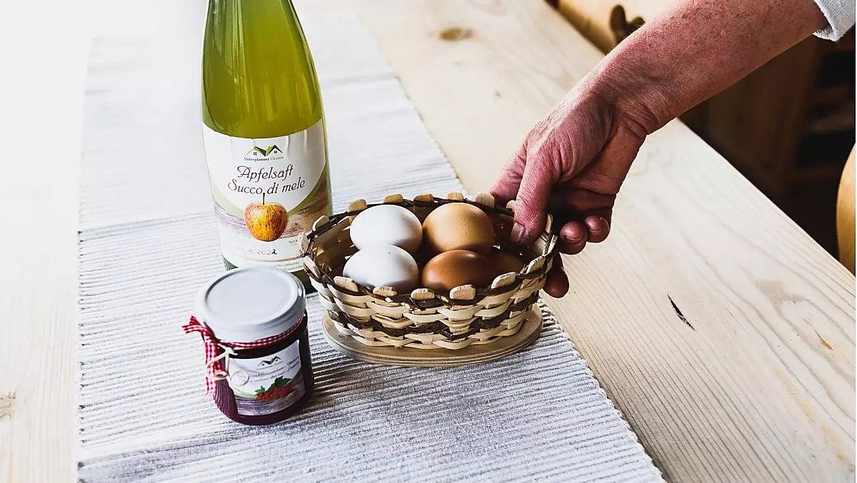 Homemade fruit spread, naturally cloudy apple juice and eggs from our chickens