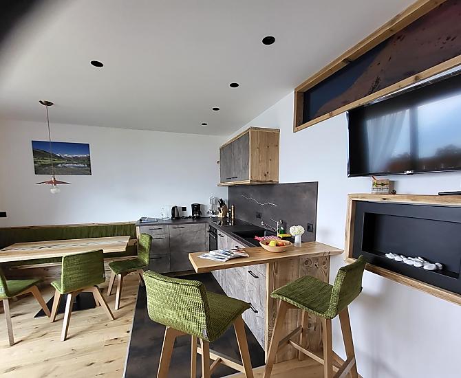 Kitchen and living room in the 'Waldesduft' apartment