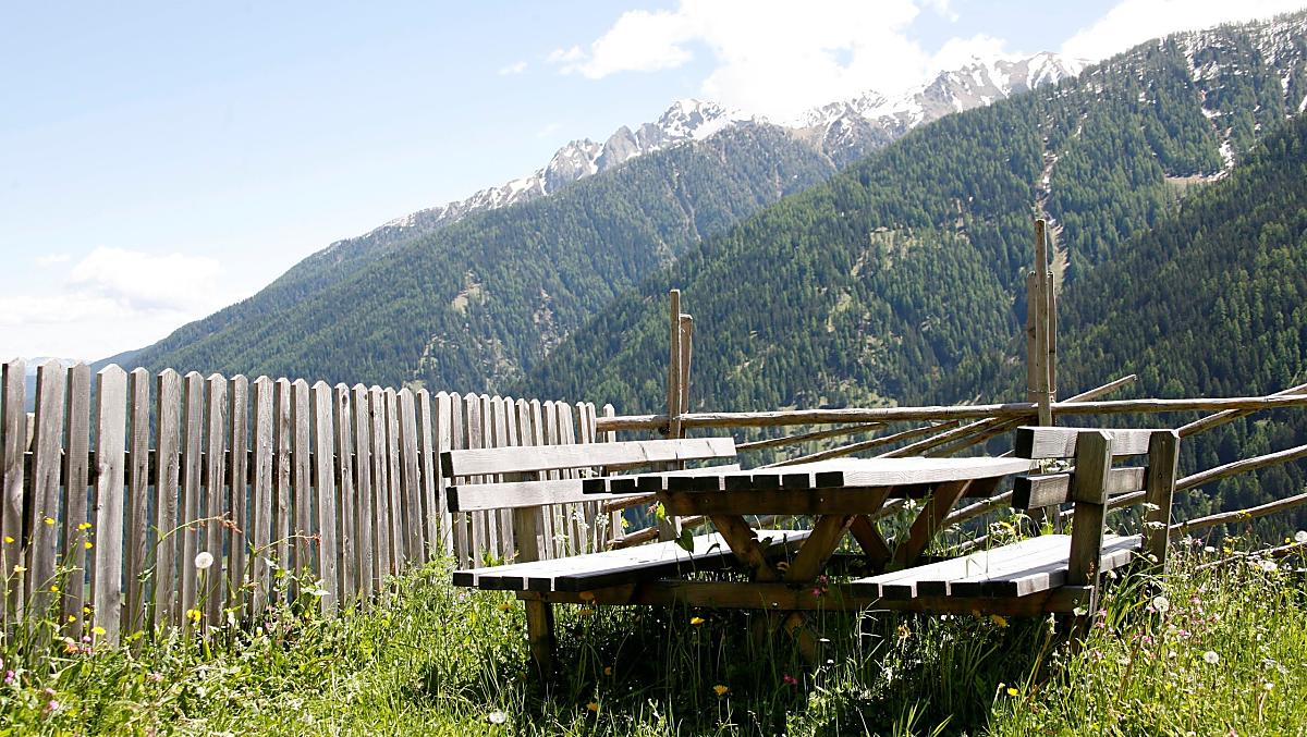 Seating area with views of the valley, lake and moutains.
